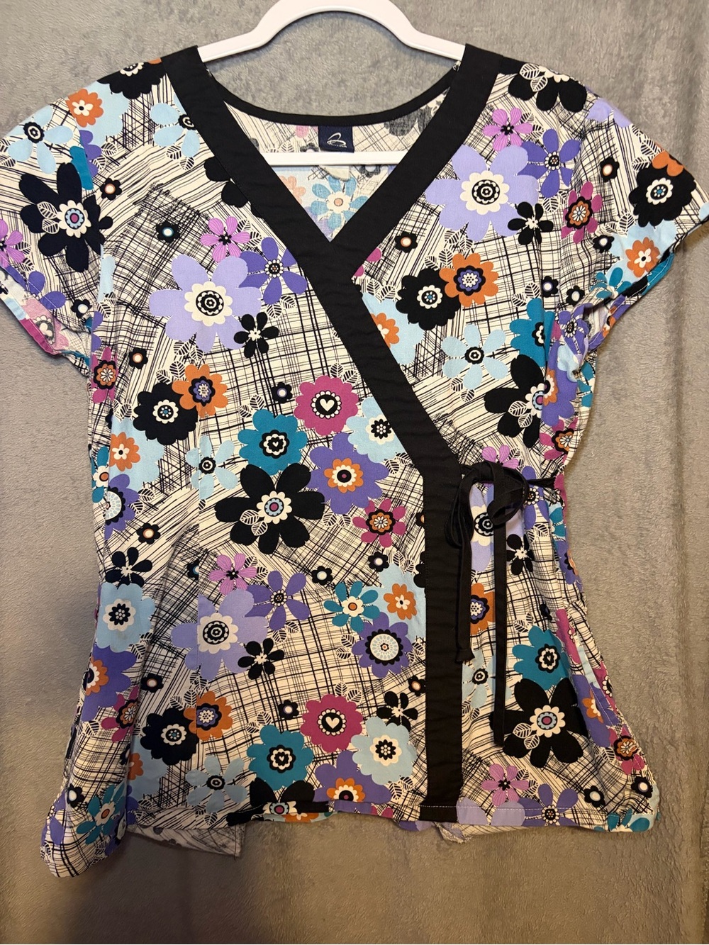 Multicolor Floral Wrap Scrub Top with Black Trim